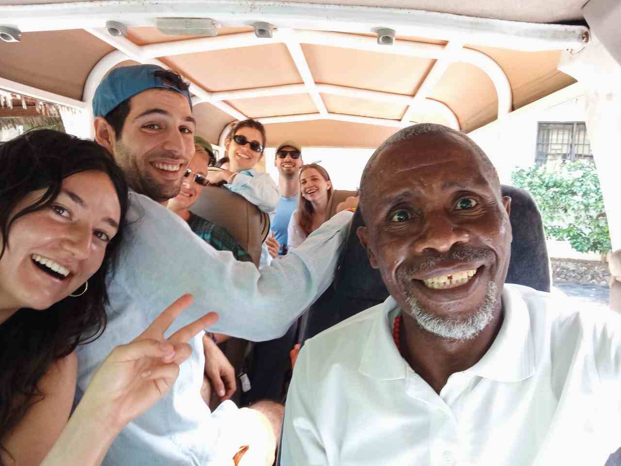 Group selfie in the safari van with the guide