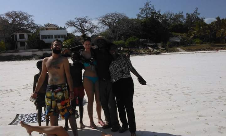 Group photo on the beach after a day trip
