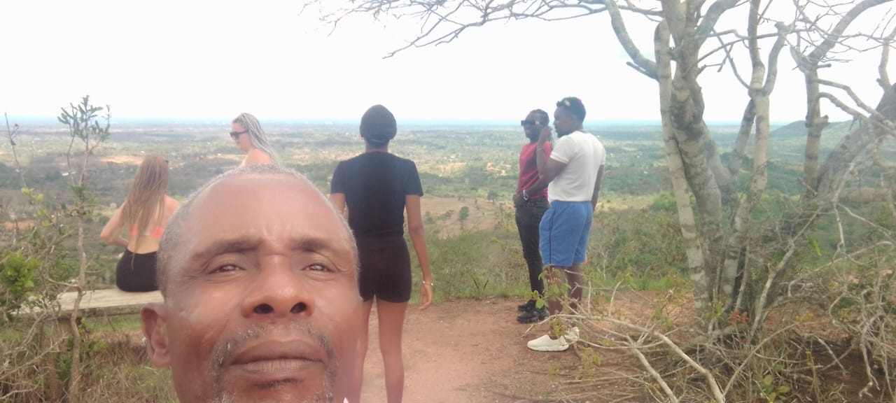 Guide and guests at a viewpoint on a custom trip